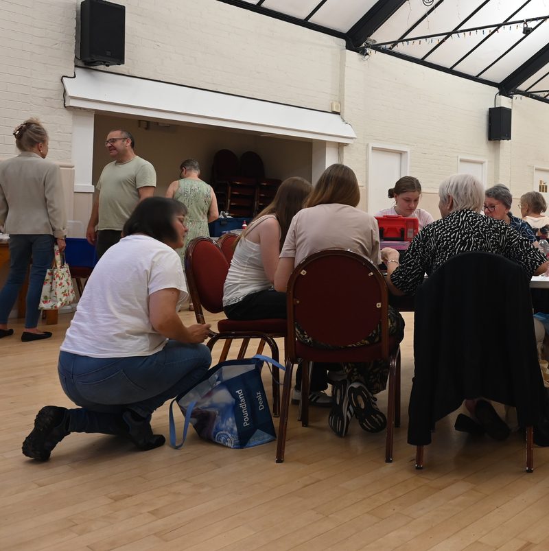 Dolls House Club members working on miniature projects at Howard Hall