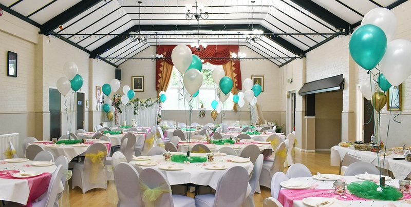 The Main Hall dressed for a party with balloons and round tables